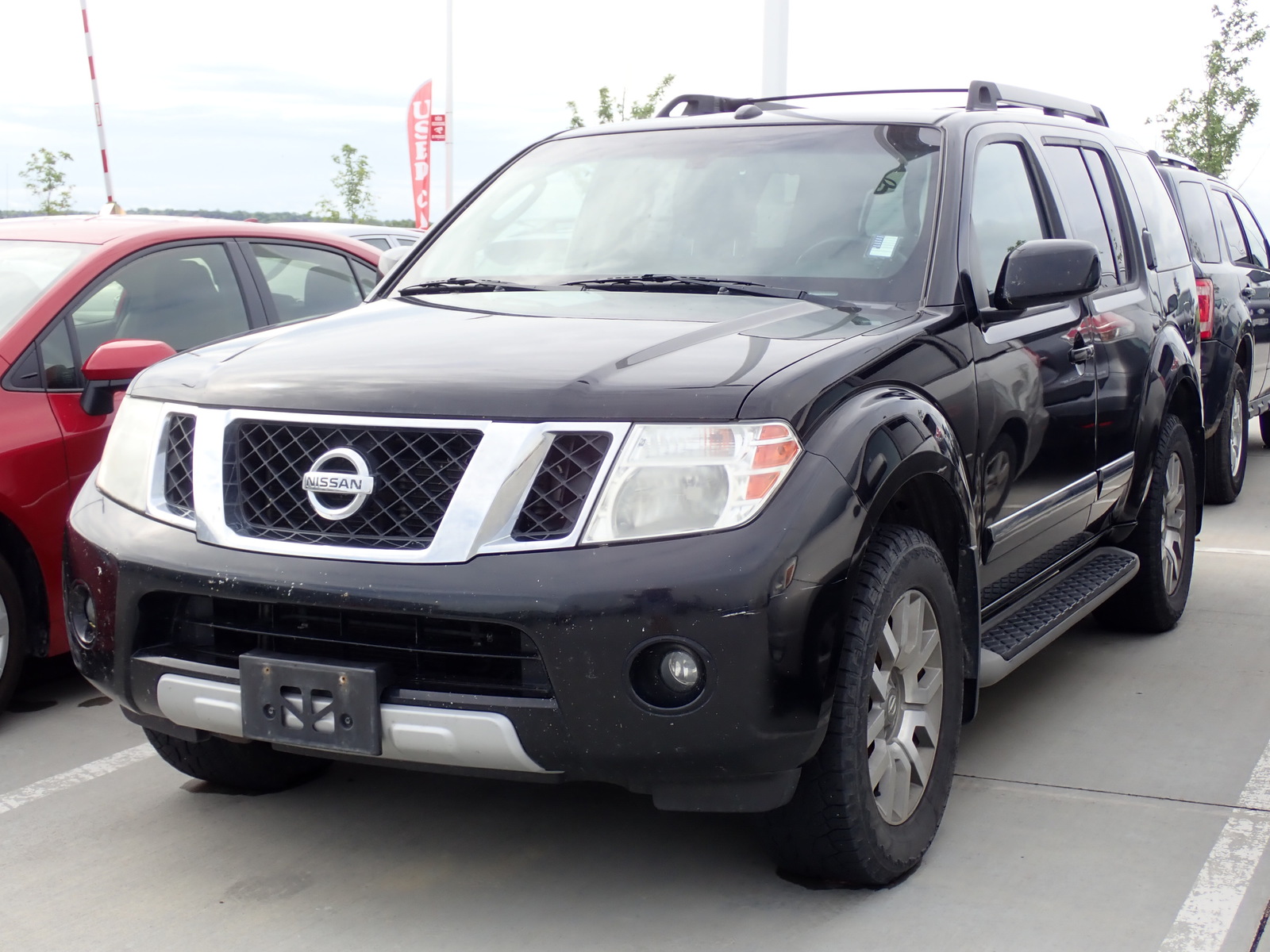 Pre-Owned 2010 Nissan Pathfinder 4WD 4dr V6 LE Sport Utility in Lincoln